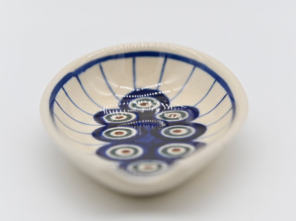 Don't get your counter nasty. Polish Pottery Spoon Rest Off White Base Color Blue, Green, Burgandy Peacock Eyes Modern Patterned Circles Mid Mod Collectible Kitchen Decor Retro Ceramic Collector Gift