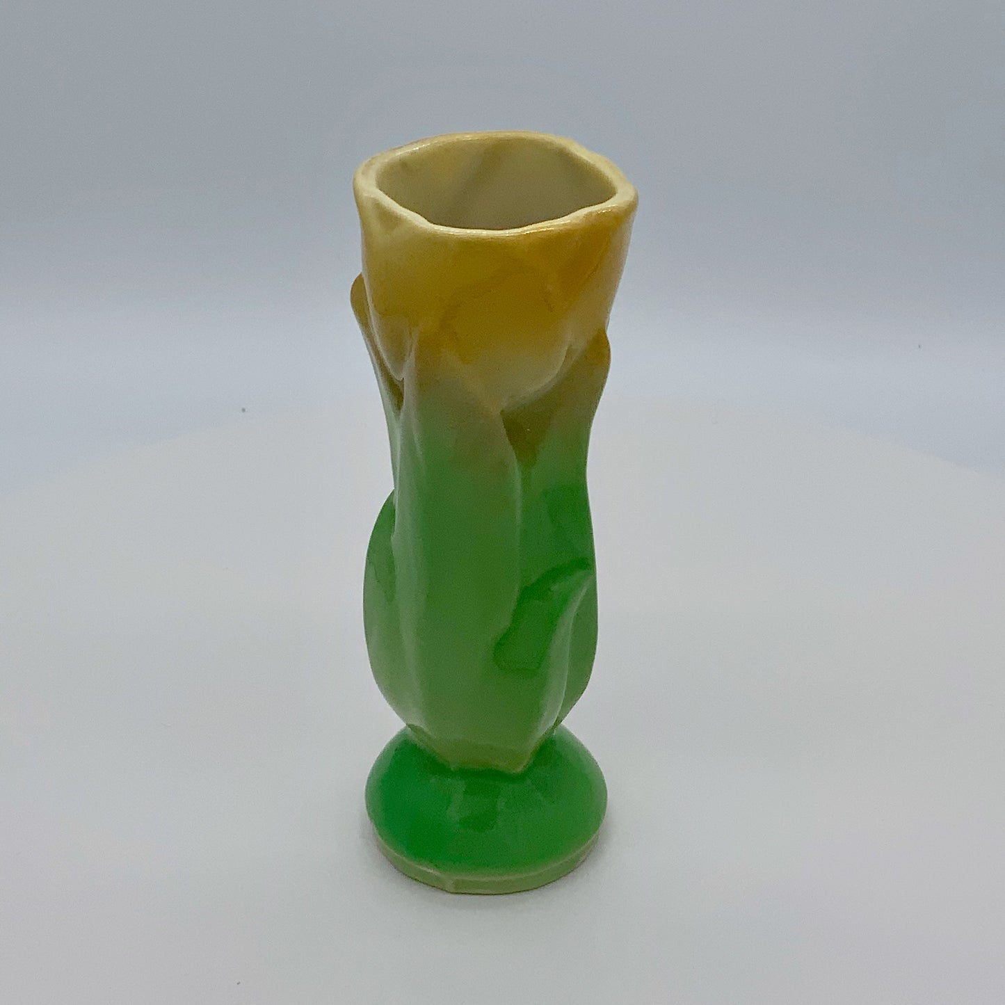Vintage Shawnee Pottery Figural Vibrant Yellow Tulip With Green Leaves Approximately 4.75" Tall x 1.5" Diameter "USA 1115" Marked on Bottom No Chips, Cracks, Crazing Typical mold marks from rough edges under the glaze.