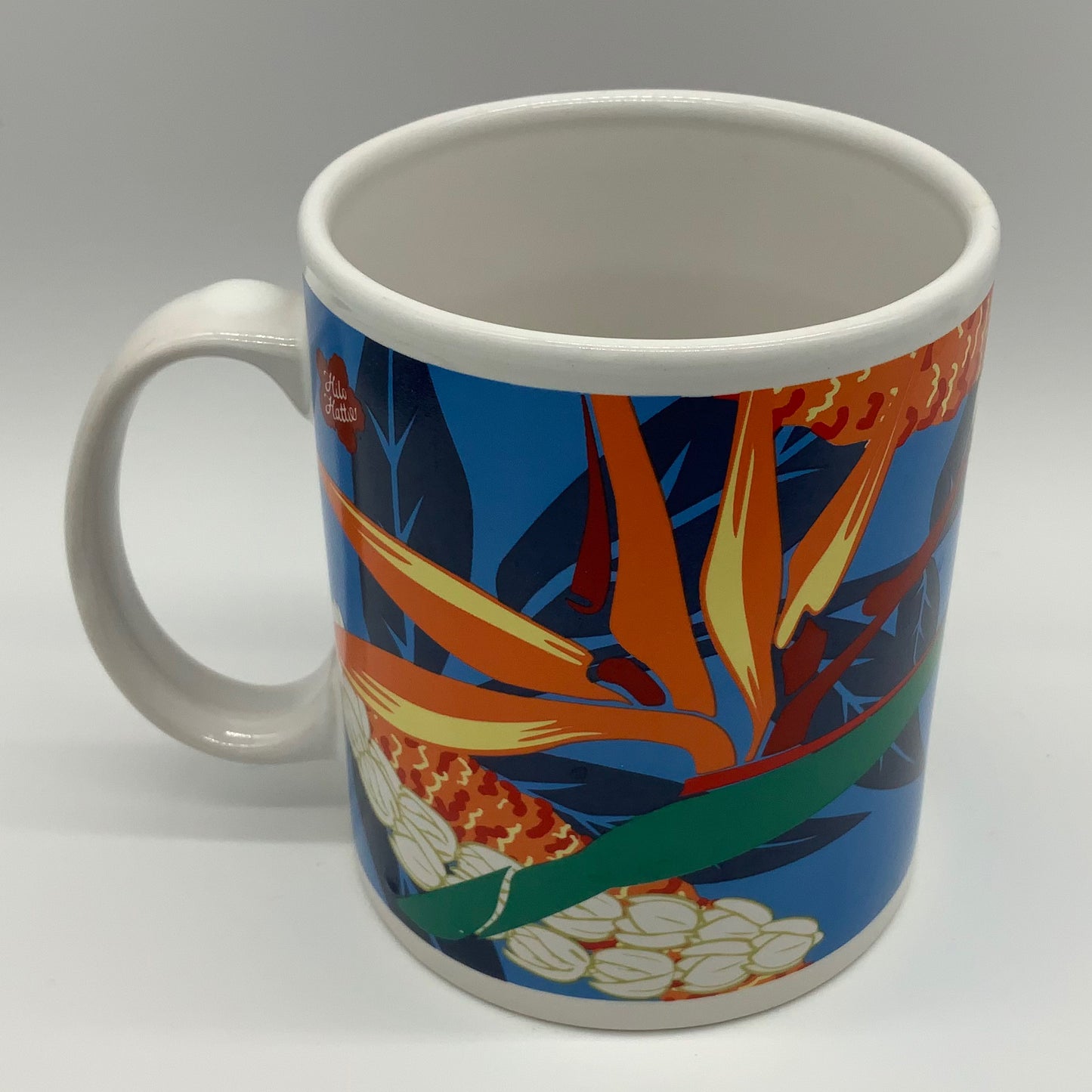 Rad Retro 1999 Hawaii Hilo Hattie Coffee Mug Vibrant Bird of Paradise Floral Design Store of Hawaii 1999 Island Heritage Vibrant Orange Blue Green Tea Starbucks Collector Hang Loose Flowers Surf Surfer Travel PreCovid Souvenir Collectible Vintage reuse repurpose be uniquely you mmb midmodandbeyond #shopsmall