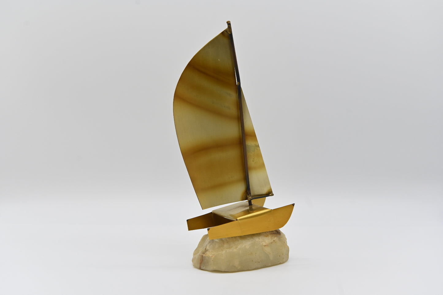 Like unique items? Buy it. Mid Century Mod Brass and Copper Metal Sailboat Sculpture Quartz Rock Base Vintage Retro Collection Metalware Sculpture Art Sailor Boating Ocean Water Sports Collecting Studio Movie Prop decor decoration shelf sitter