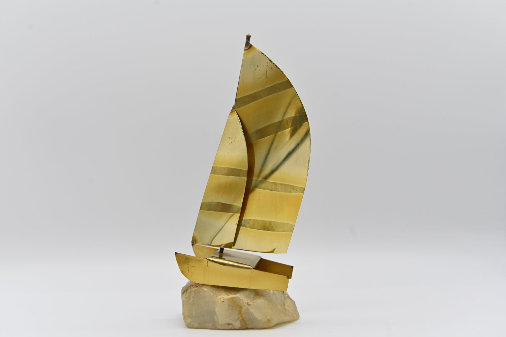 Like unique items? Buy it. Mid Century Mod Brass and Copper Metal Sailboat Sculpture Quartz Rock Base Vintage Retro Collection Metalware Sculpture Art Sailor Boating Ocean Water Sports Collecting Studio Movie Prop decor decoration shelf sitter