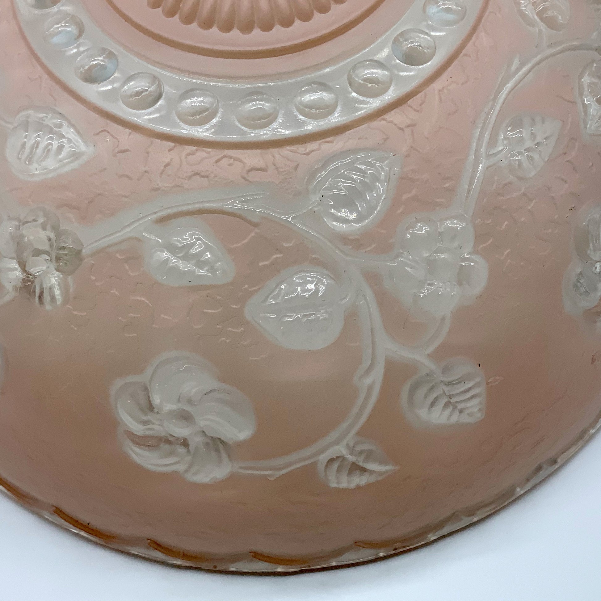 1945-1950's Post War Era  Clear and Blush Pink Pressed Glass Ceiling Light Shade Features a center circular nipple style design adorned with a repeating flower and leaf pattern. Dusty pink is painted airbrushed on the outside and the embossed raised floral pattern is clear.  10.25 Diameter x 4" Deep  Three Glass Hole Mounts  No Chips or Cracks