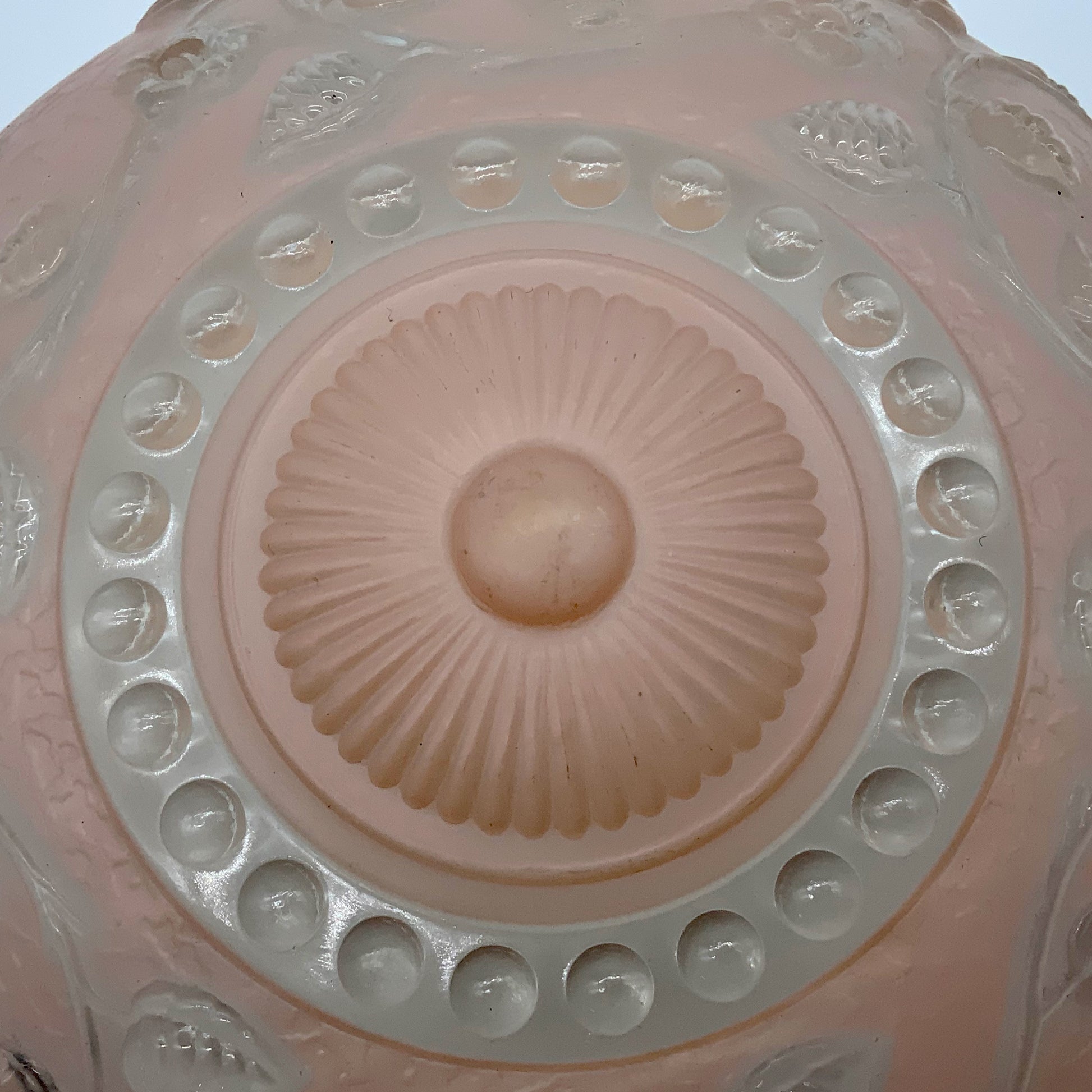 1945-1950's Post War Era  Clear and Blush Pink Pressed Glass Ceiling Light Shade Features a center circular nipple style design adorned with a repeating flower and leaf pattern. Dusty pink is painted airbrushed on the outside and the embossed raised floral pattern is clear.  10.25 Diameter x 4" Deep  Three Glass Hole Mounts  No Chips or Cracks