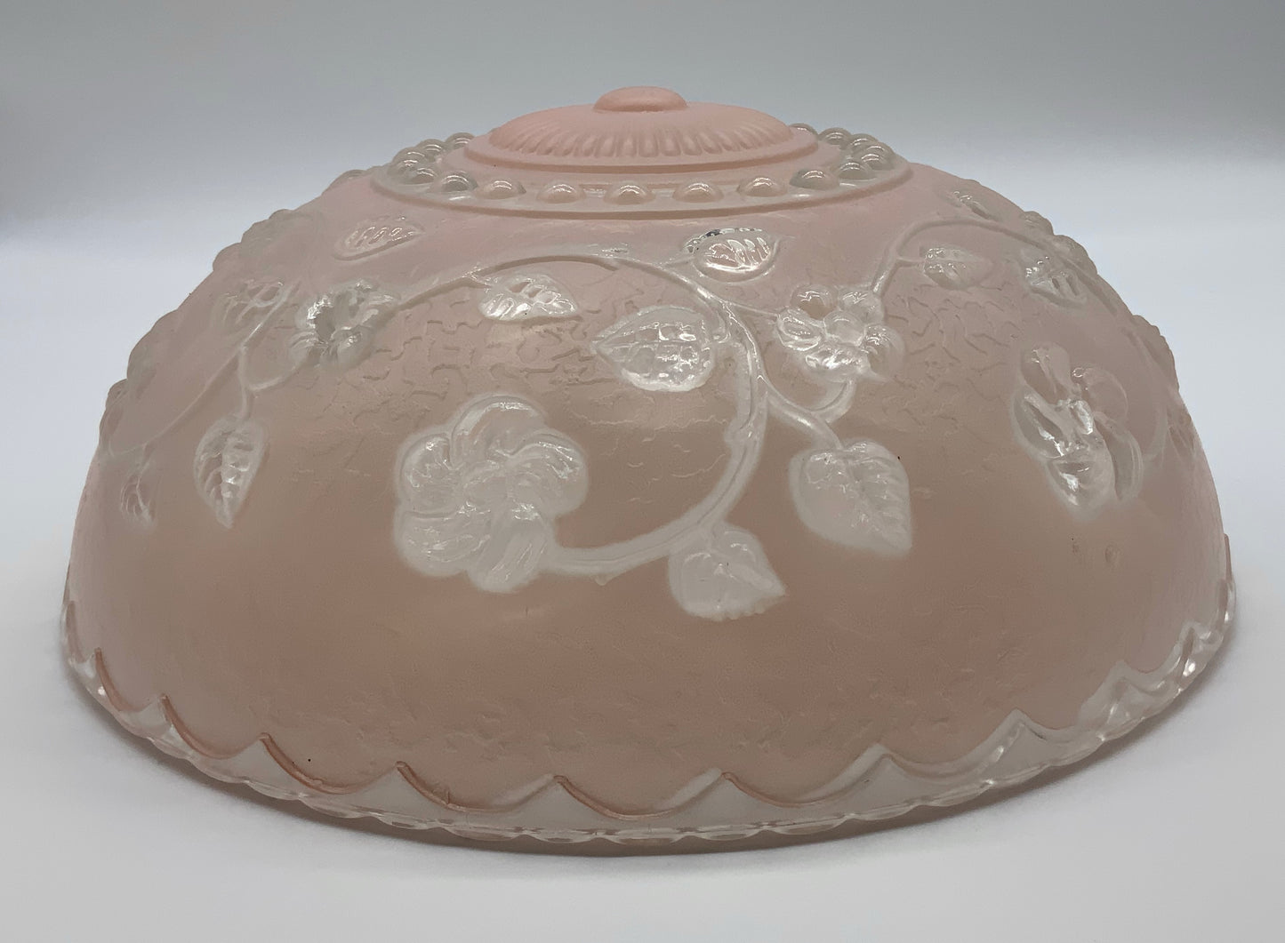 1945-1950's Post War Era  Clear and Blush Pink Pressed Glass Ceiling Light Shade Features a center circular nipple style design adorned with a repeating flower and leaf pattern. Dusty pink is painted airbrushed on the outside and the embossed raised floral pattern is clear.  10.25 Diameter x 4" Deep  Three Glass Hole Mounts  No Chips or Cracks