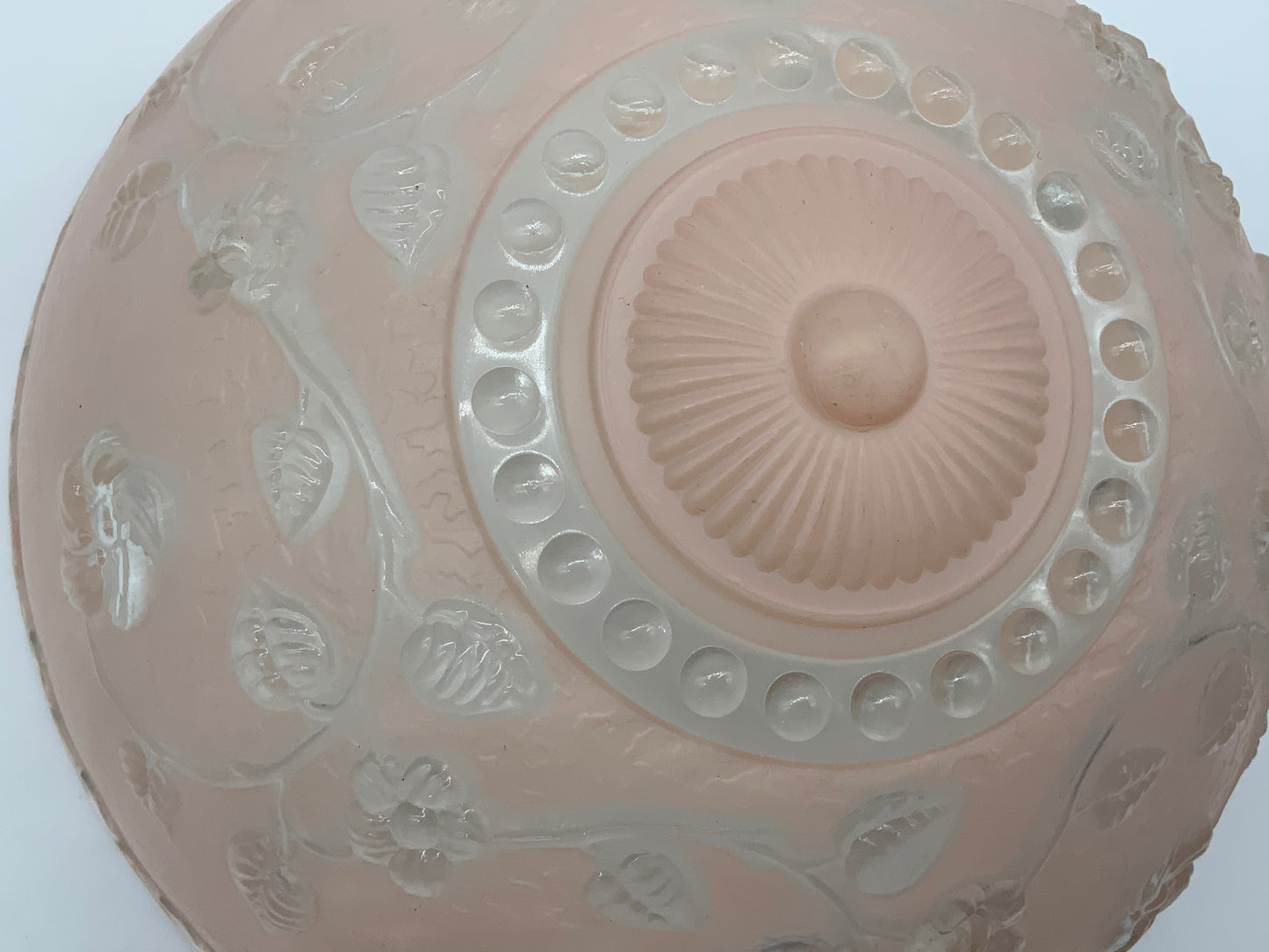 1945-1950's Post War Era  Clear and Blush Pink Pressed Glass Ceiling Light Shade Features a center circular nipple style design adorned with a repeating flower and leaf pattern. Dusty pink is painted airbrushed on the outside and the embossed raised floral pattern is clear.  10.25 Diameter x 4" Deep  Three Glass Hole Mounts  No Chips or Cracks