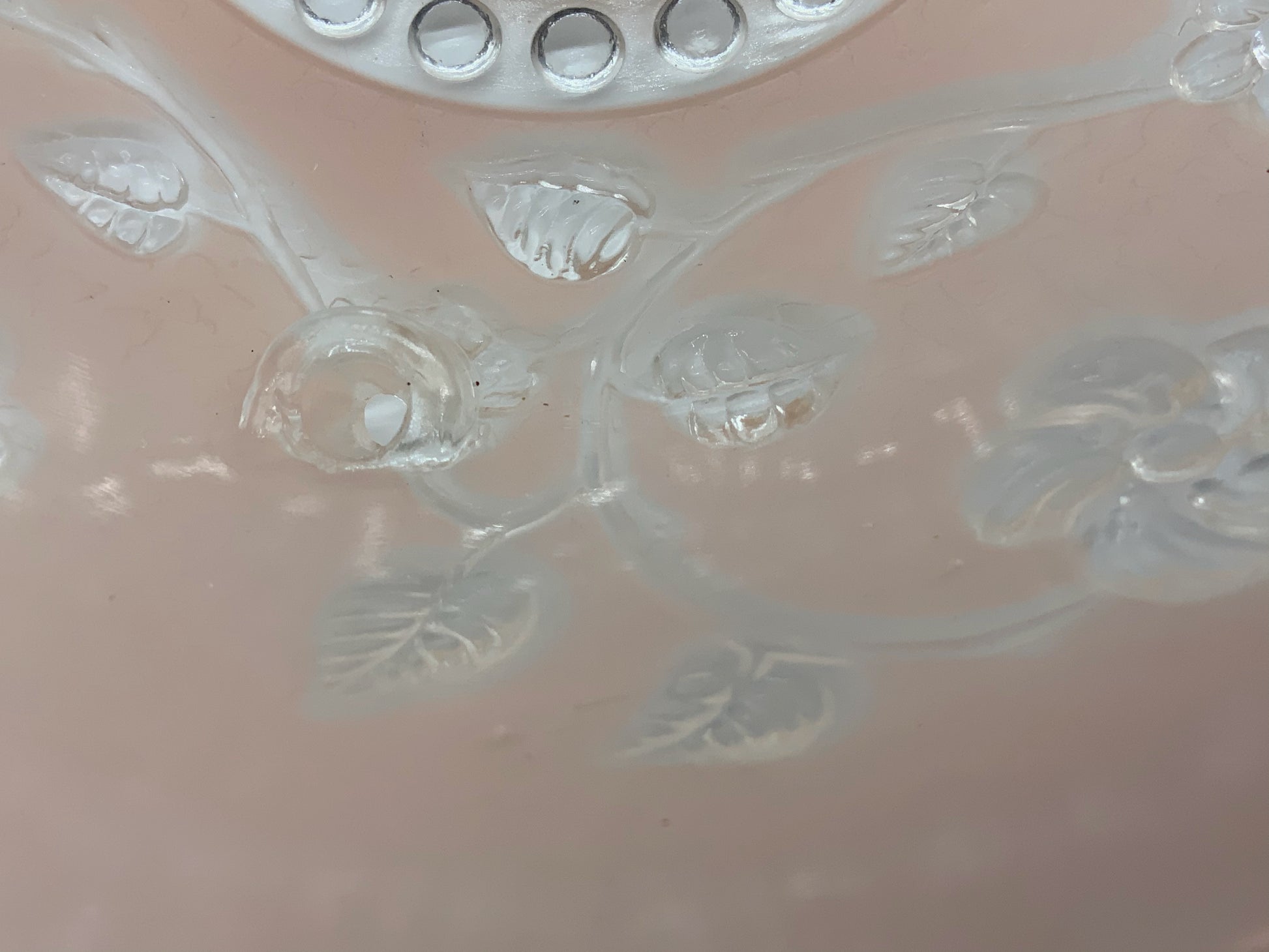 1945-1950's Post War Era  Clear and Blush Pink Pressed Glass Ceiling Light Shade Features a center circular nipple style design adorned with a repeating flower and leaf pattern. Dusty pink is painted airbrushed on the outside and the embossed raised floral pattern is clear.  10.25 Diameter x 4" Deep  Three Glass Hole Mounts  No Chips or Cracks