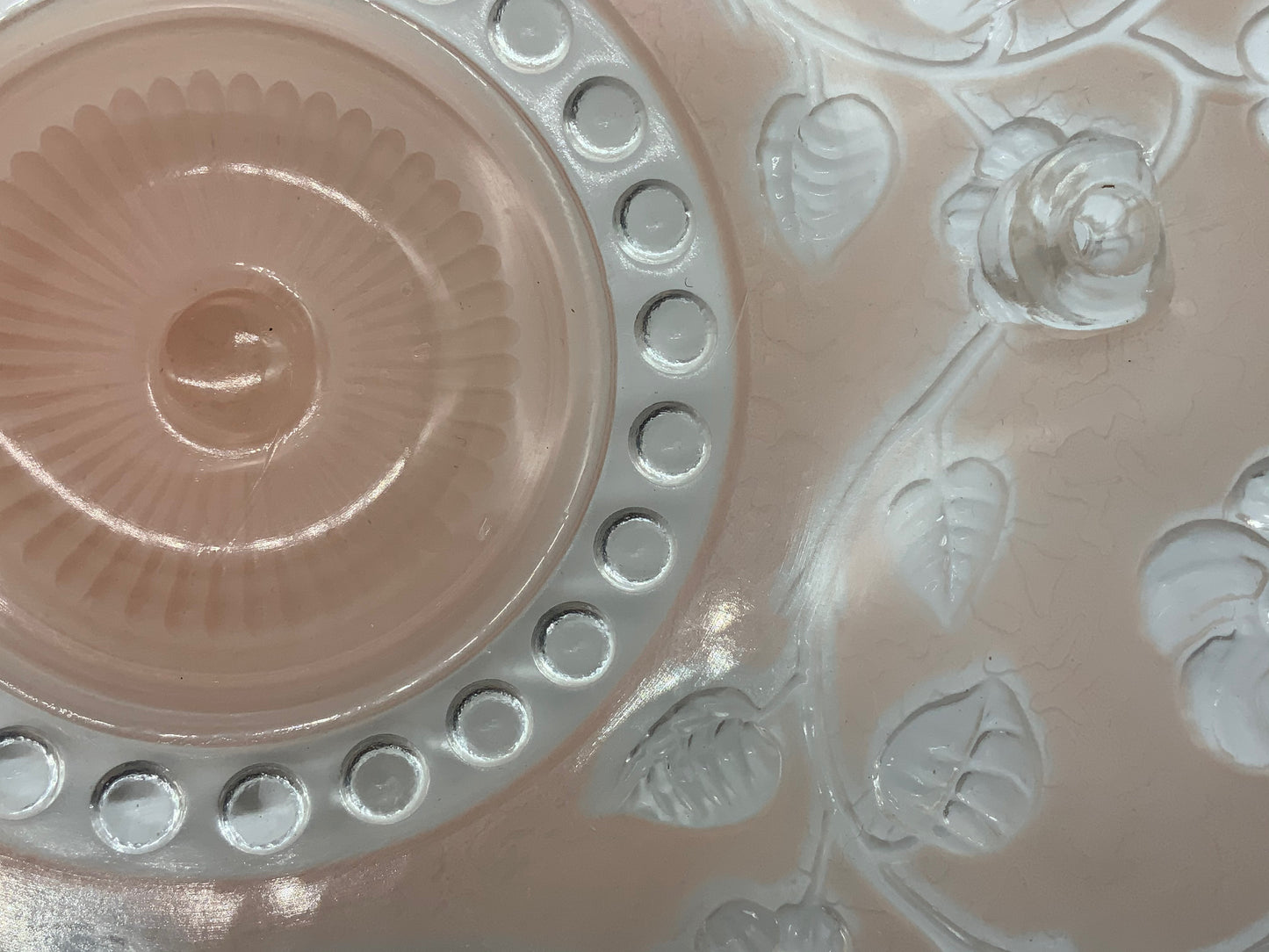 1945-1950's Post War Era  Clear and Blush Pink Pressed Glass Ceiling Light Shade Features a center circular nipple style design adorned with a repeating flower and leaf pattern. Dusty pink is painted airbrushed on the outside and the embossed raised floral pattern is clear.  10.25 Diameter x 4" Deep  Three Glass Hole Mounts  No Chips or Cracks