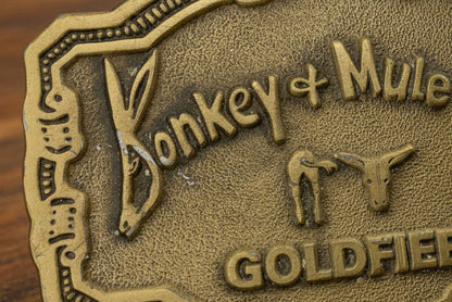 Brass Colored Metal Belt Buckle Featuring Donkey and Mule Day Goldfielt Iowa Hit Line USA Scratch on D and O