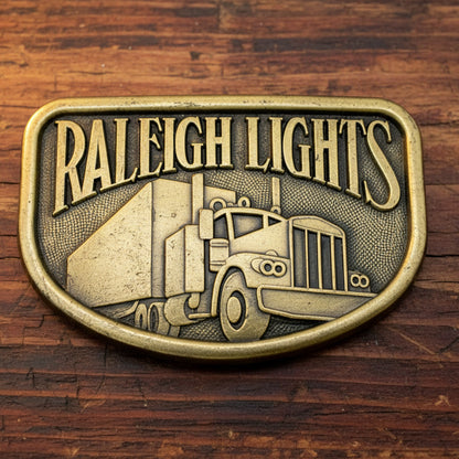 1970s Era Raleigh Lights  Semi Truck  Belt Buckle  Brass Colored Metal  Marked "RJ" On Back 